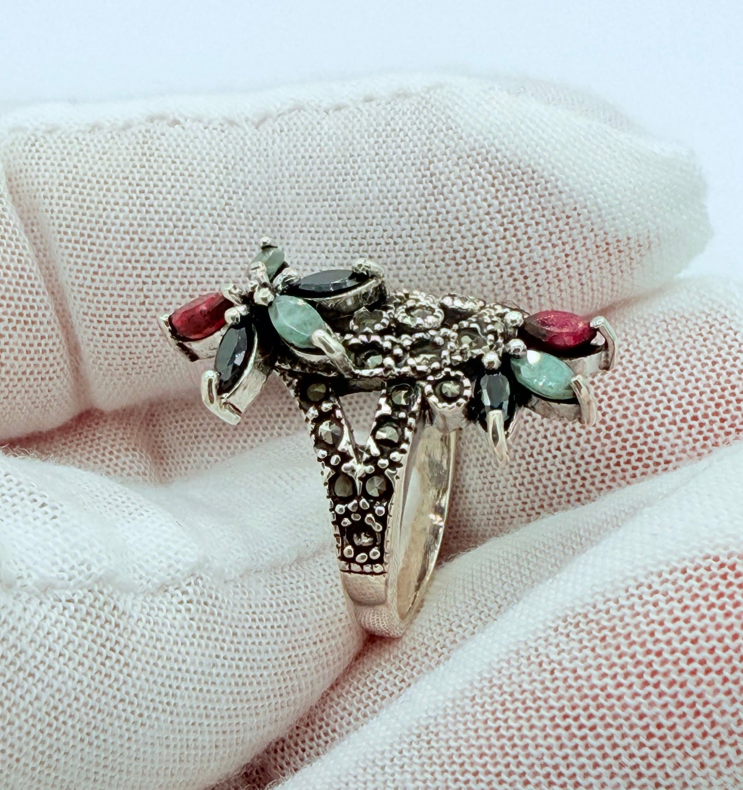 inlaid with. natural Ruby, emerald stone